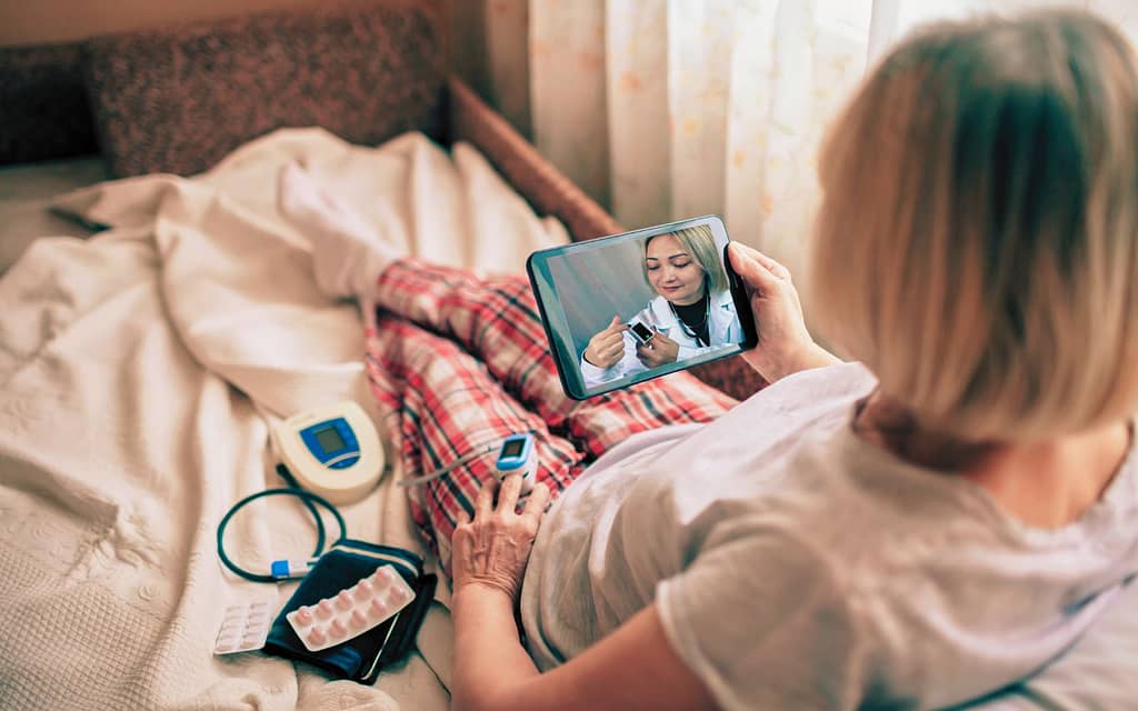 a medical professional conducting a virtual check-in as part of the CPT Code G2012.
