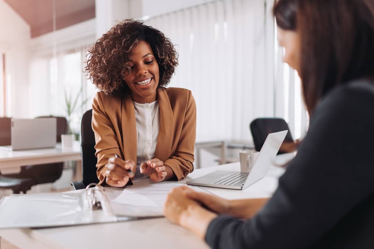 businesswoman-discussing-documents-with-client