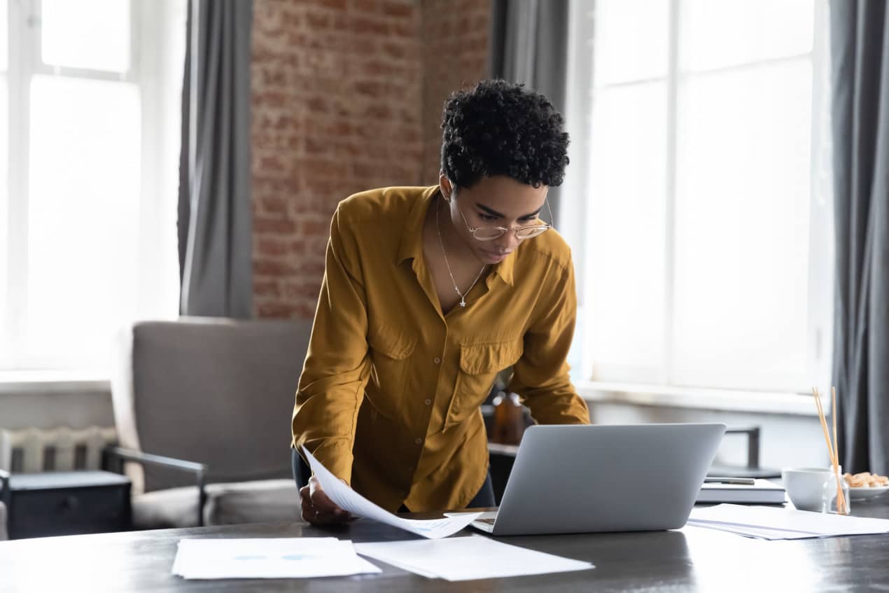 Focused professional working at laptop