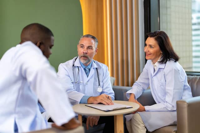 Doctors meeting discussing patient care